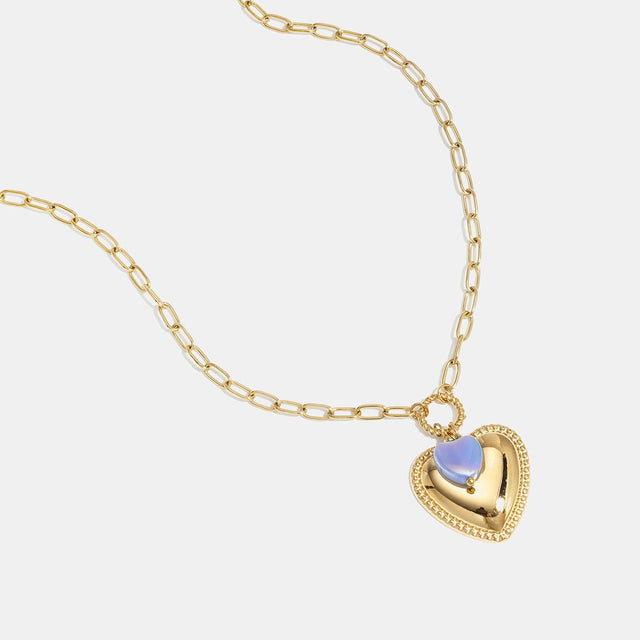Collier cœur doré et cristal lilas Lumé sur fond clair